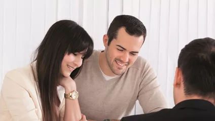 man and woman in meeting with another man