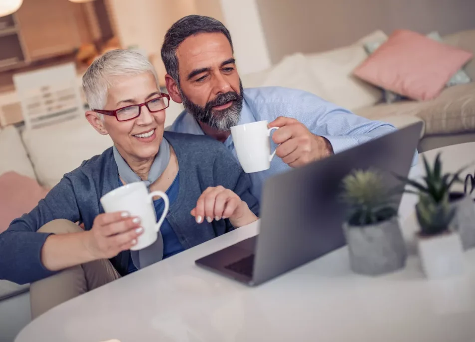 man and woman on laptop